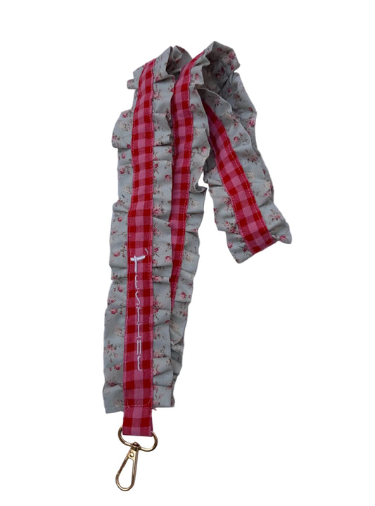 Cuelga móvil volantes rosa